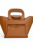 Brown leather handbag with a visible brand logo on a white background