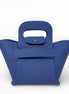 Blue handbag with a unique handle design on a white background