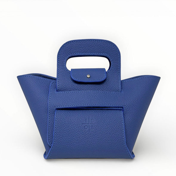 Blue handbag with a unique handle design on a white background